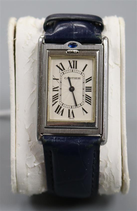 A gentlemans 2004 stainless steel Cartier Tank Basculante reverso manual wind wrist watch, ref. 2390, with box and papers.